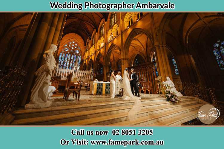 Photo of the Bride and the Groom at the altar Ambarvale NSW 2560