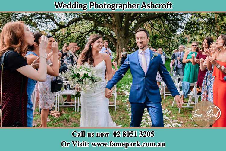 Photo of the Bride and the Groom showering bubbles by the visitors Ashcroft NSW 2168