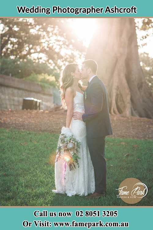 Photo of the Bride and the Groom kissing at the yard Ashcroft NSW 2168