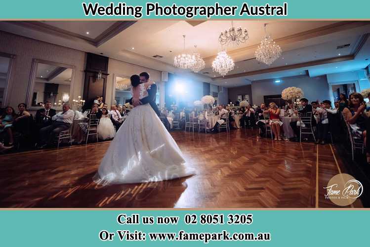 Photo of the Bride and the Groom hugging on the dance floor Austral NSW 2179