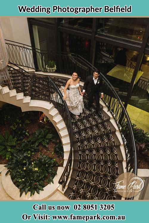 Photo of the Bride and the Groom going down the stair Belfield NSW 2191