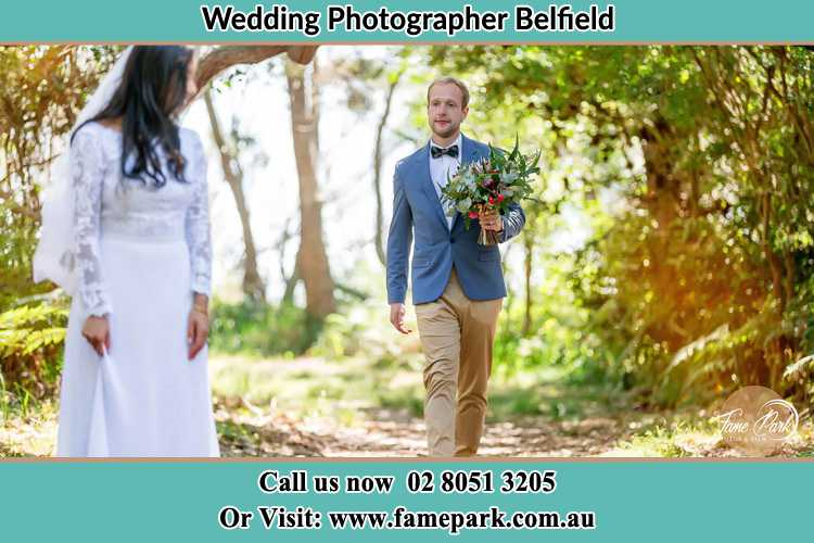 Photo of the Groom bringing flower to the Bride Belfield NSW 2191