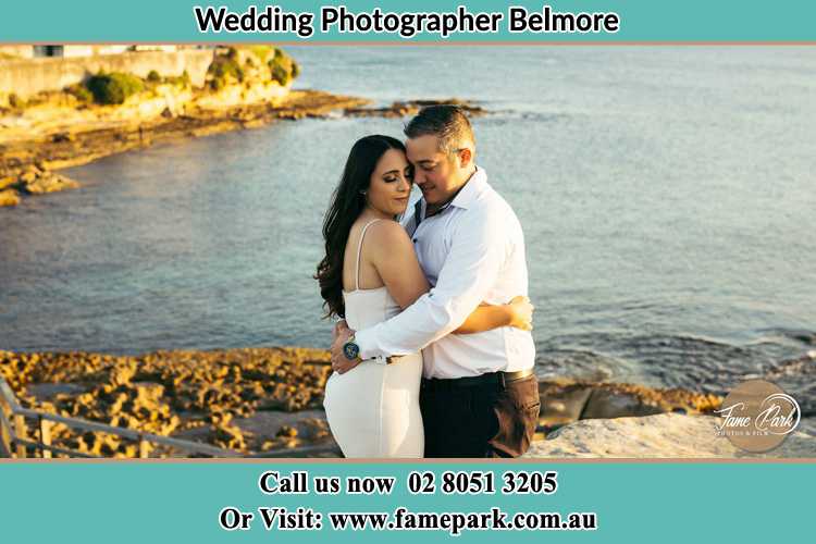 Photo of the Bride and the Groom hugging near the lake Belmore NSW 2192