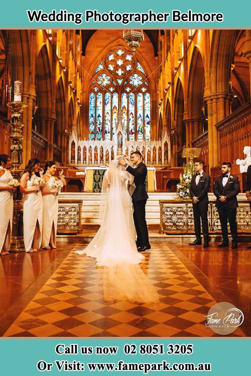 Photo of the Groom and the Bride with the entourage at the altar Belmore NSW 2192