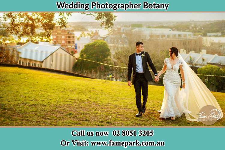 Photo of the Groom and the Bride walking at the yard Botany NSW 2019