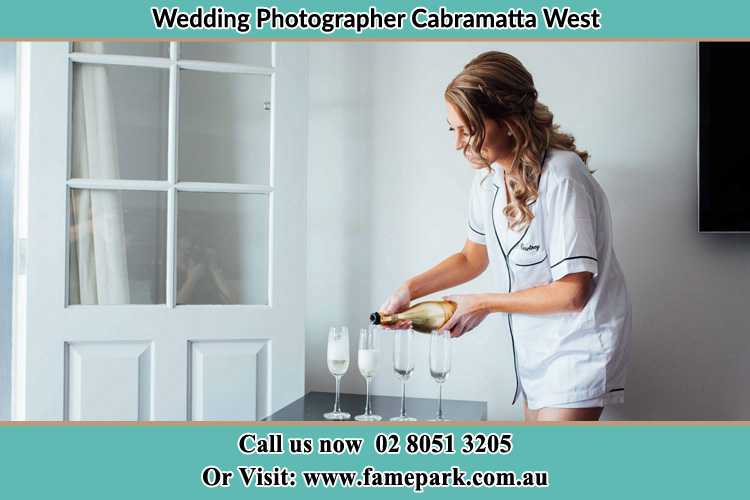 Photo of the Bride pouring wine to the glasses Cabramatta West NSW 2166