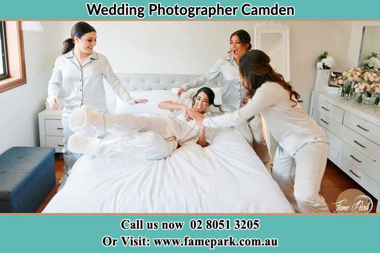 Photo of the Bride and the bridesmaids playing on bed Camden NSW 2570