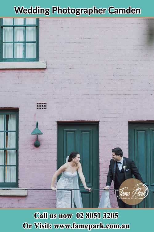 Photo of the Bride and the Groom looking each other at the balcony Camden NSW 2570