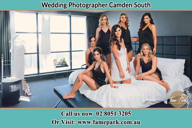 Photo of the Bride and the bridesmaids wearing lingerie on bed Camden South NSW 2570