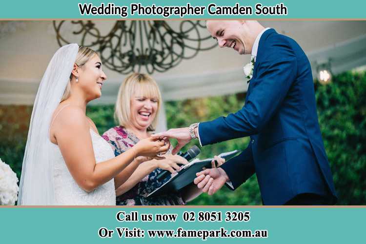 Photo of the Bride wearing ring to the Groom Camden South NSW 2570