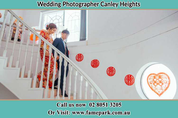 Photo of the Bride and the Groom going down the stair Canley Heights NSW 2166