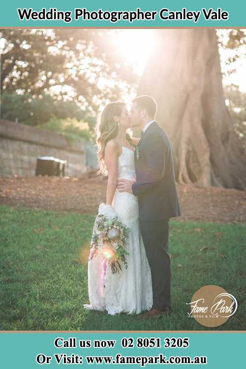 Photo of the Bride and the Groom kissing at the yard Canley Vale NSW 2166