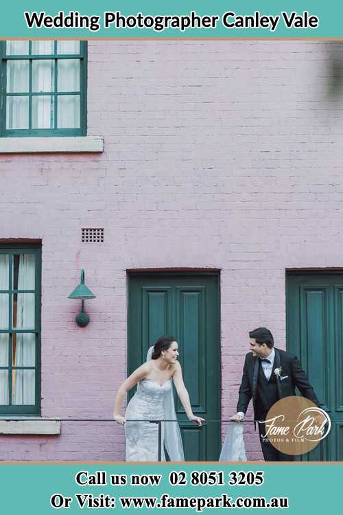 Photo of the Bride and the Groom looking each other at the balcony Canley Vale NSW 2166