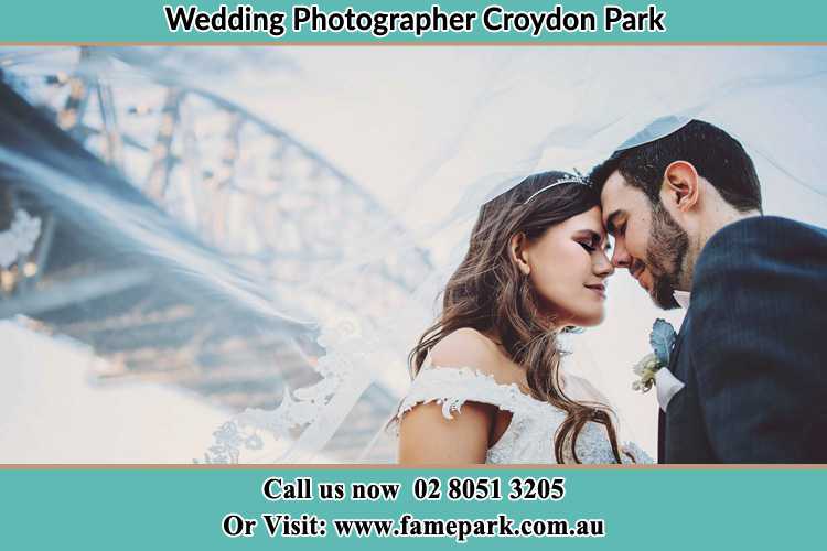 Close up photo of the Bride and the Groom under the bridge Croydon Park NSW 2133