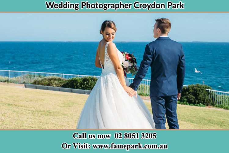 Photo of the Bride and the Groom holding hands at the yard Croydon Park NSW 2133