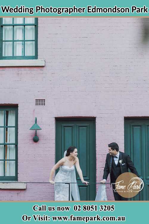 Photo of the Bride and the Groom looking each other at the balcony Edmondson Park NSW 2174