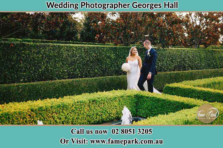 Photo of the Bride and the Groom walking at the garden Georges Hall NSW 2198