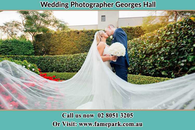 Photo of the Bride and the Groom kissing at the garden Georges Hall NSW 2198