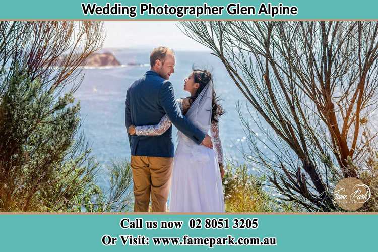 Photo of the Groom and the Bride looking each other near the sea front Glen Alpine NSW 2560