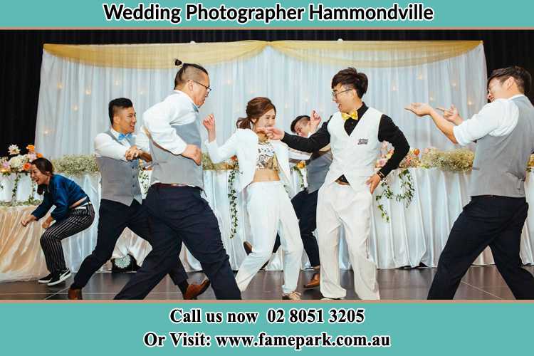 Photo of the Groom and the Bride dancing with the groomsmen on the dance floor Hammondville NSW 2170