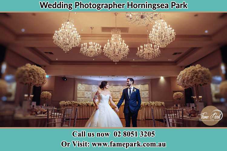 Photo of the Bride and the Groom holding hands on the dance floor Horningsea Park NSW 2171