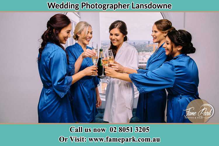 Photo of the Bride and the bridesmaids having wine Lansdowne NSW 2430