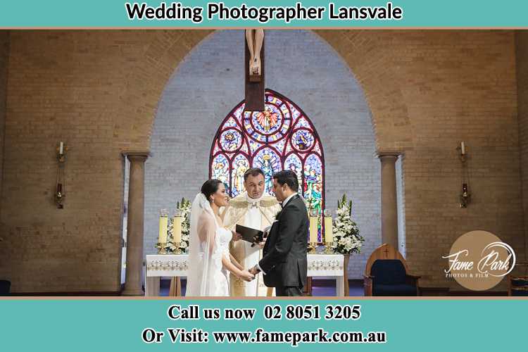 Photo of the Bride and Groom at the Altar with the Priest Lansvale NSW 2166