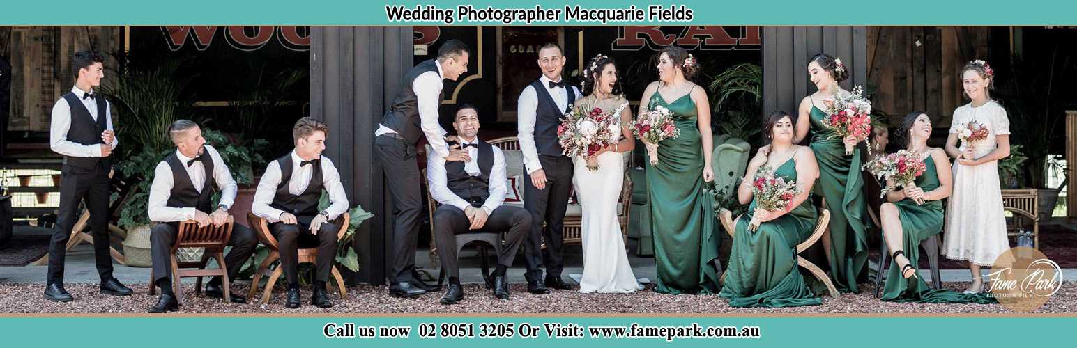 The Bride and the Groom with their entourage pose for the camera Macquarie Fields NSW 2564