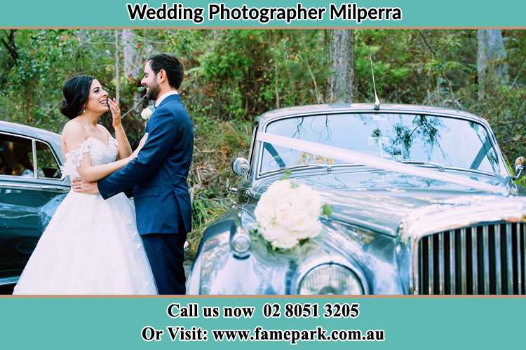 Photo of the Bride and the Groom near the bridal car Milperra NSW 2214