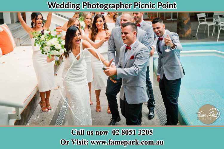 Photo of the Groom and the Bride celebrating with the secondary sponsors Picnic Point NSW 2213