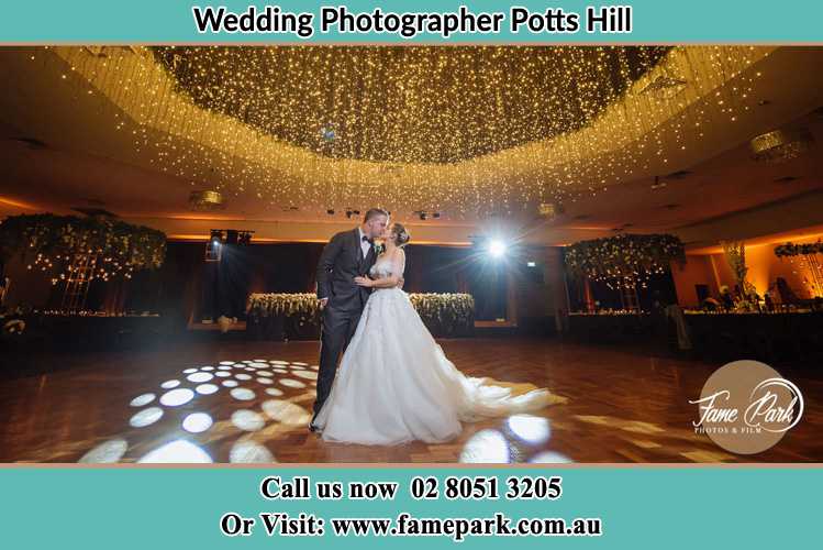 Photo of the Bride and the Groom kissing on the dance floor Potts Hill NSW 2143