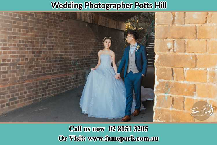 Photo of the Bride and the Groom walking Potts Hill NSW 2143