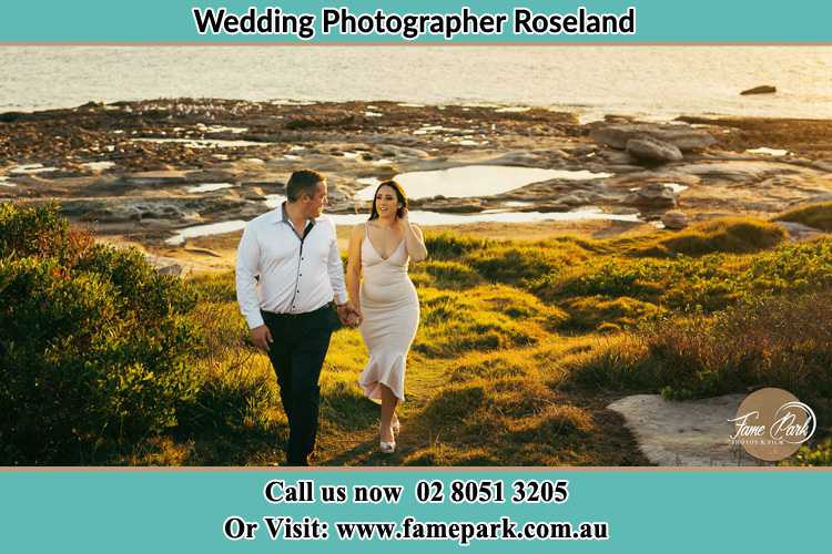 Photo of the Groom and the Bride walking near the lake Roseland NSW 2196