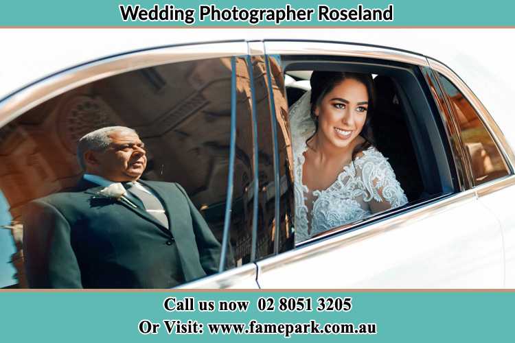 Photo of the Bride inside the bridal car with her father standing outside Roseland NSW 2196