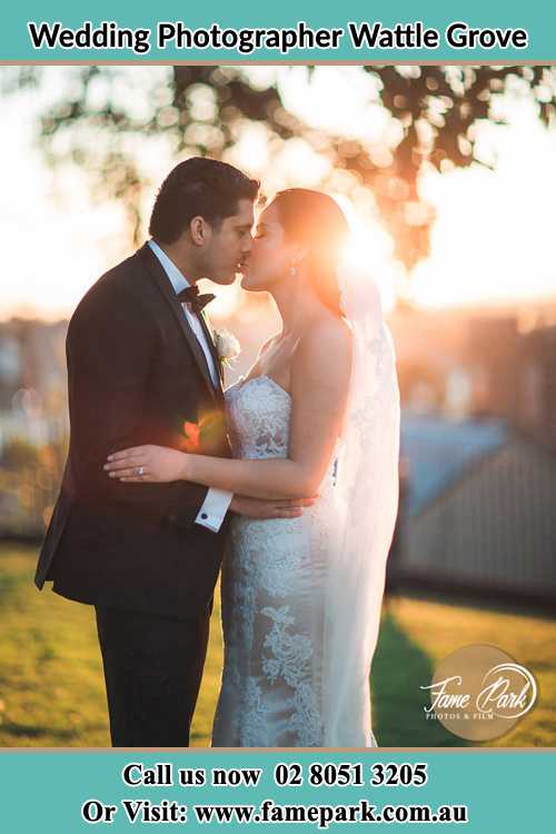 Photo of the Groom and the Bride kissing at the yard Wattle Grove NSW 2713