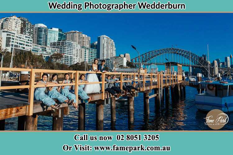 Photo of the Groom and the Bride with the entourage at the bridge Wedderburn NSW 2560